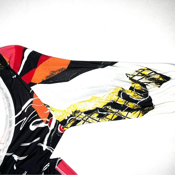 Save the Queen Ladies top. Medium Elbow length sleeves. Metal medallion accent. - Picture 8 of 13